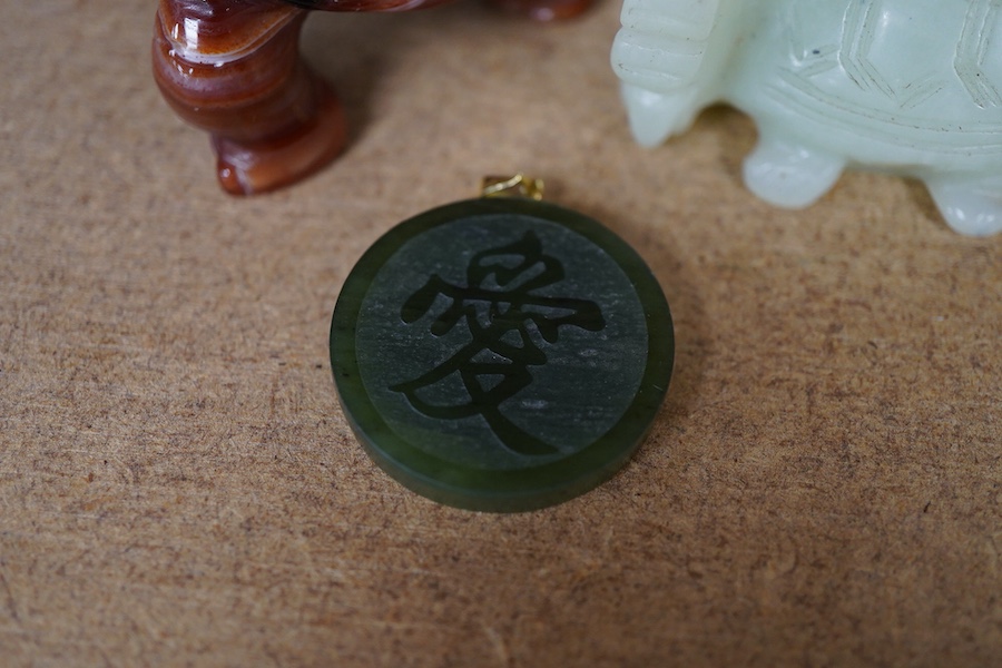 A Chinese carved jade pendant and two hardstone carved animals, pendant 3cm diameter.